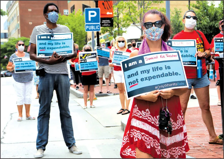 More than 100 educators and other community members turned out for a rally on July 30 in Malden