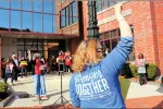 Bridget Reed, a teacher at Wakefield Memorial High School, gestured to the crowd during a March 25 demonstration at the Department of Elementary and Secondary Education’s Malden headquarters to protest the state’s overreach on school reopenings and MCAS testing