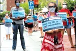 More than 100 educators and other community members turned out for a rally on July 30 in Malden