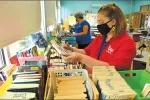 Special education teacher Olivia Baker, right, spent a recent afternoon organizing books with Springfield Education Association Vice President Brenda Dunn at the Daniel B. Brunton School.