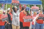 Brockton paraprofessionals rallied outside a public library on June 27, waving signs to build support for a stronger contract. The local is seeking a $25-an-hour starting wage for members.