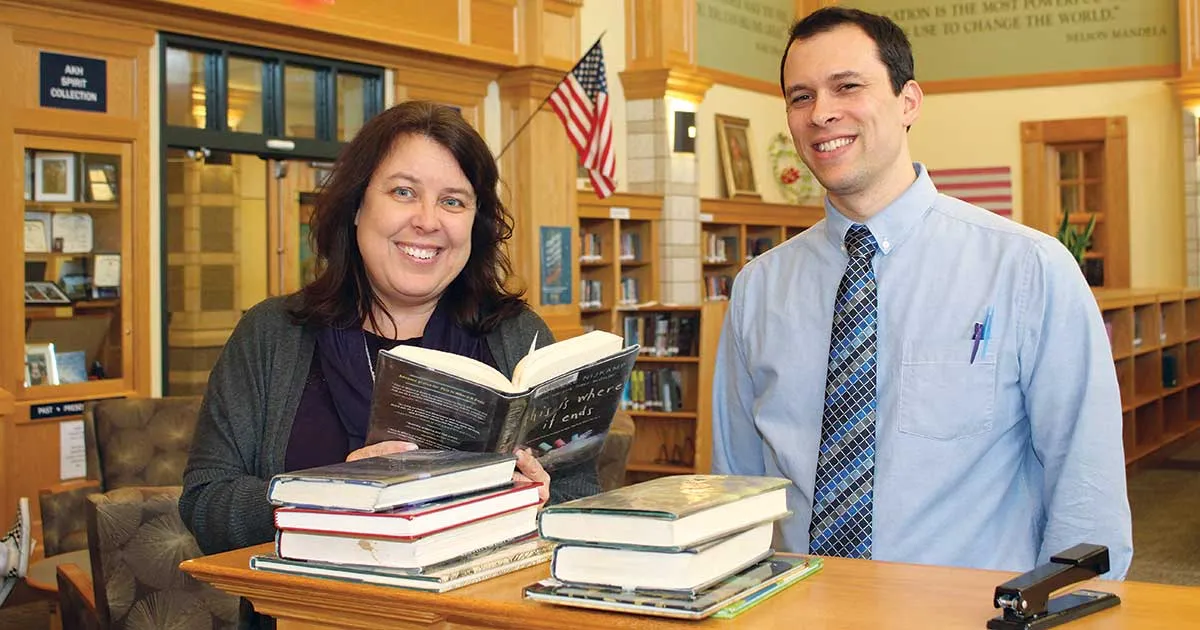 East Bridgewater Junior-Senior High School librarian Carrie Tucker looked over books with English teacher Greg Shea.