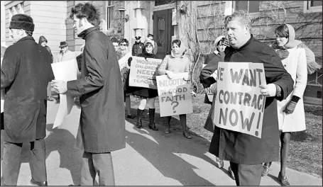 Striking teachers marched in a picket line outside Woburn High School in 1970